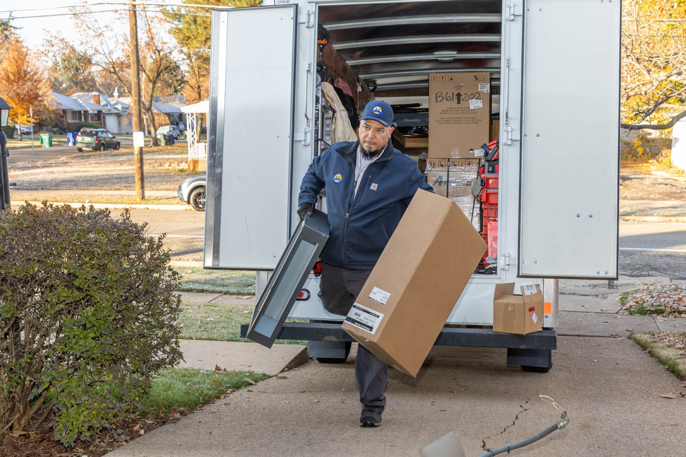 
		Absolute Comfort technician moving high-quality equipment out of our trucks - professional  hvac service.
	