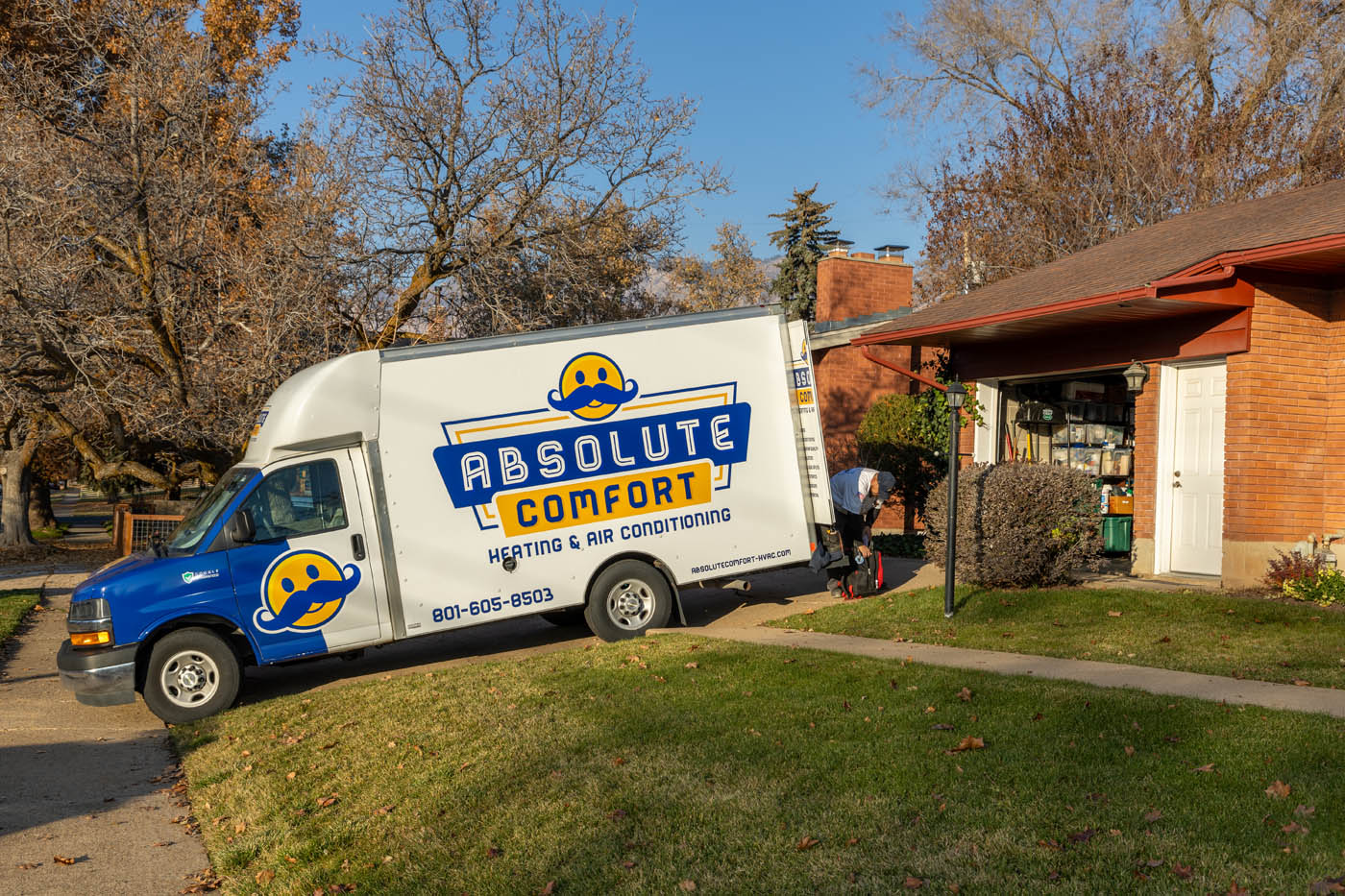 
		An Absolute Comfort service vehicle parked outside a residential property - learn what makes us the best heating and cooling contractors in Ogden, UT.
	