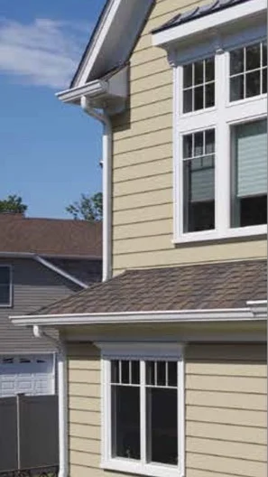 Fiber Cement Siding By James Hardie – Delaware Valley - Pennsylvania Two-story home with gray and tan fiber cement siding