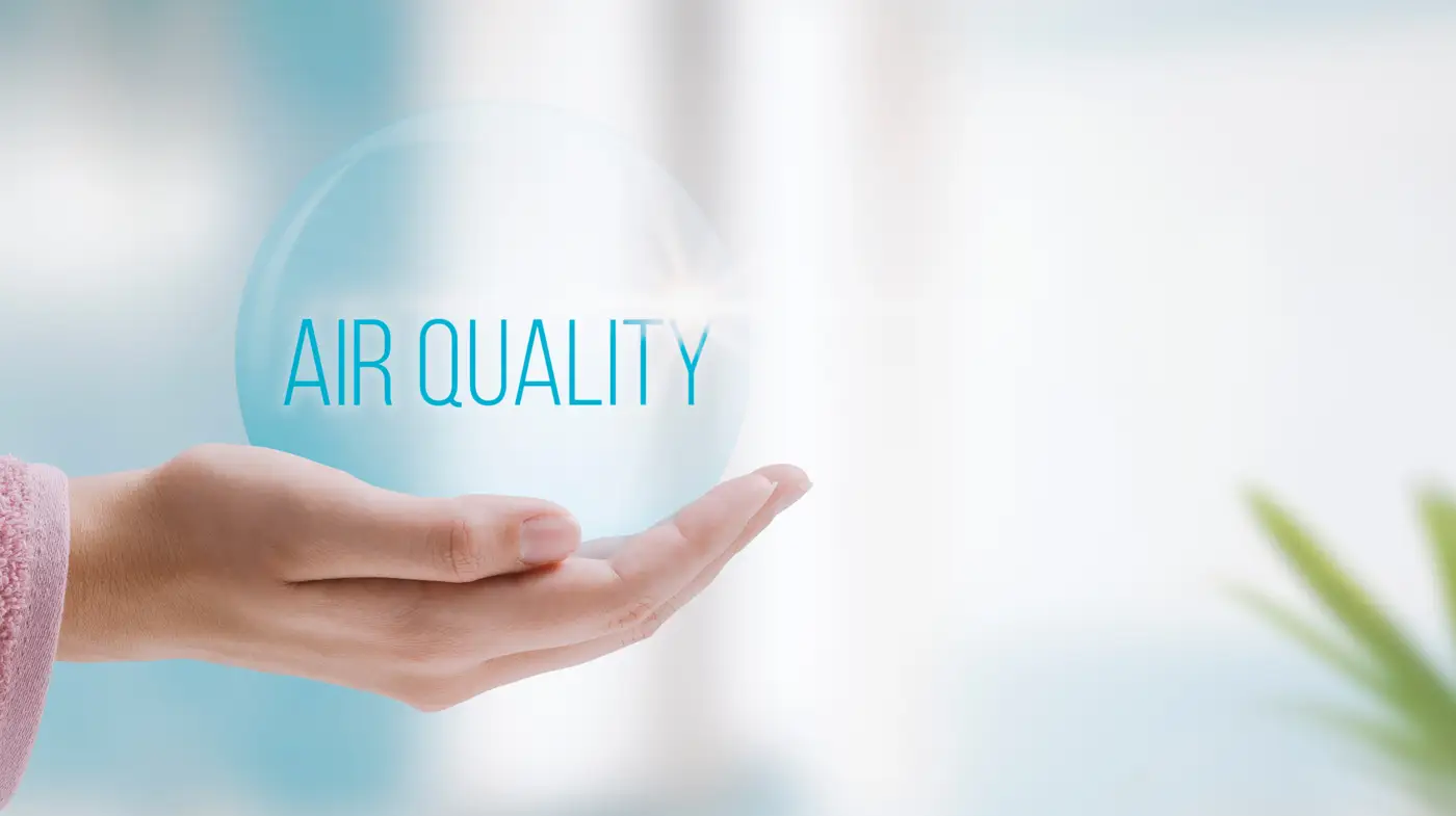 A hand holds a A hand holds a bubble with the words “air quality” inside of it in South Ogden, UT for Absolute Comfort with the words “air quality” inside of it in South Ogden, UT for Absolute Comfort