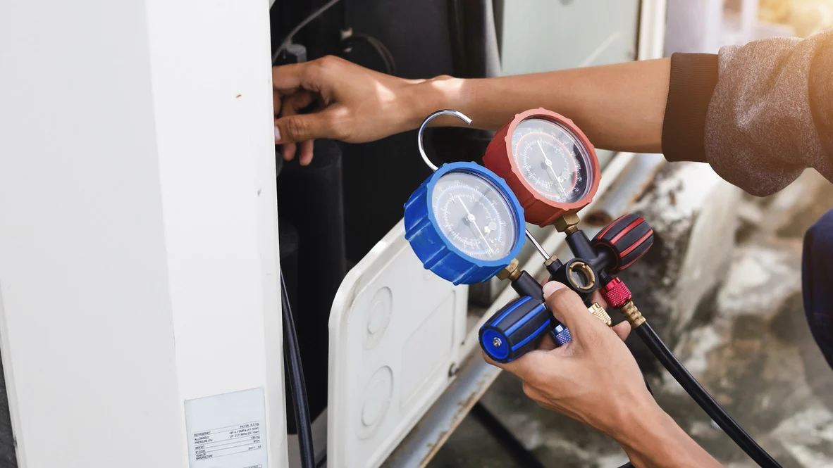 AC technician performs heat pump tune-up for Ogden homeowner